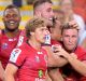 BRISBANE, AUSTRALIA - FEBRUARY 24: Queensland Reds players celebrate their victory after the round one Super Rugby match ...