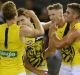 Josh Caddy of the Tigers celebrates a goal with teammates.