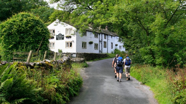 Walkers approach the George Inn, Hubberholme.