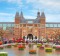 I Amsterdam slogan with crowd of tourists in Amsterdam at the back of the Rijksmuseum. 