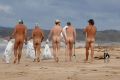 Nudists taking part in "Clean up Australia Day". Being nude on the beach remains illegal in Queensland.