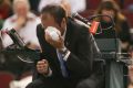 Chair umpire Arnaud Gabas reacts to getting hit in the eye with a ball.