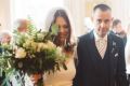 Angelia Cuming and her husband Paul walk down the aisle on their wedding day. 