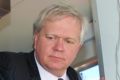 ANU Vice-Chancellor Brian Schmidt serves food at Mr Papa.