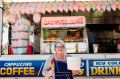 It's not a show experience without a Dagwood Dog - reporter Bree Winchester with her $8 dog and $10 bucket of fairy floss.