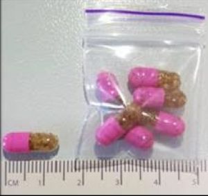 The drug is being sold in Canberra in pink and clear capsules, containing brown granular material.