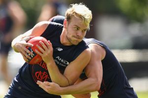 Jack Watts is tackled by Angus Brayshaw during a Melbourne training session last week. 