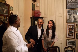 President Barack Obama and daughter Malia share a laugh as Malia interprets in Spanish for a restauranteur in Havana, Cuba, Sunday, March 20, 2016