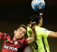 Walloping: Steve Lustica of the Wanderers contests the ball against Ryota Moriwaki of Urawa Red Diamonds at Campbelltown ...