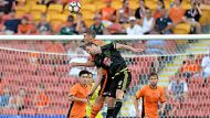 BRISBANE, AUSTRALIA - FEBRUARY 25:  Jacob Tratt of the Phoenix and Thomas Kristensen of the Roar compete for the ball ...