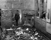 Police survey Saunderton Railway Station after a suffragette arson attack, 1913