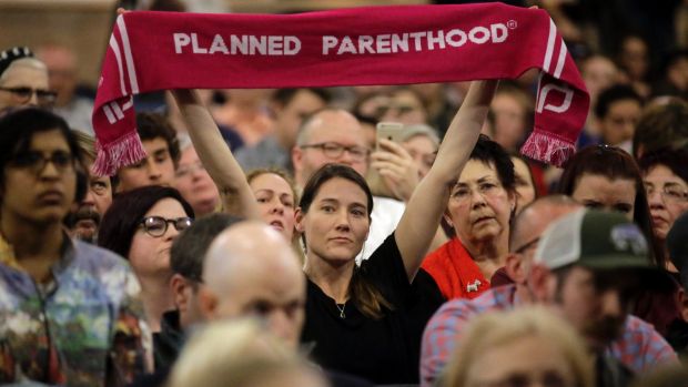 A Planned Parenthood supporter at Republican Representative Jason Chaffetz's town hall meeting.