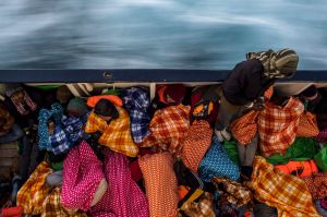 AT SEA - FEBRUARY 18: Refugees and migrants sleep on the deck of the Spanish NGO Proactiva Open Arms rescue vessel Golfo ...