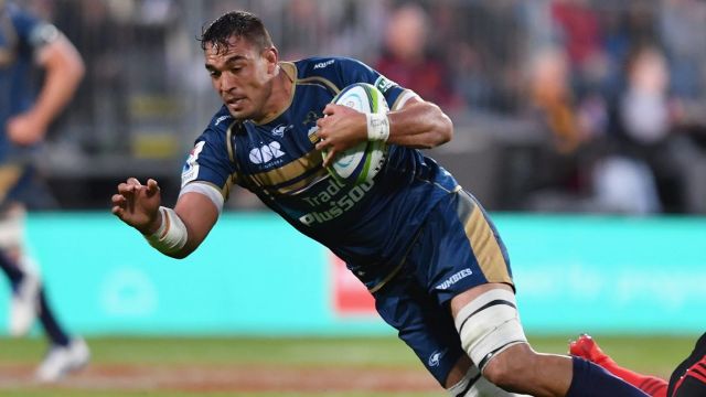 CHRISTCHURCH, NEW ZEALAND - FEBRUARY 25: Rory Arnold of the Brumbies is tackled by Ryan Crotty of the Crusaders during ...