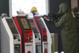 A hazmat crew scan the check in kiosk machines at Kuala Lumpur International Airport 2 in Sepang, Malaysia on Sunday, Feb. 26, 2017. Malaysian police ordered a sweep of Kuala Lumpur airport for toxic chemicals and other hazardous substances following the killing of Kim Jong Nam.