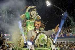 Dancers from the Mancha Verde samba school perform on a float during a carnival parade in Sao Paulo, Brazil, Saturday, Feb. 25, 2017.