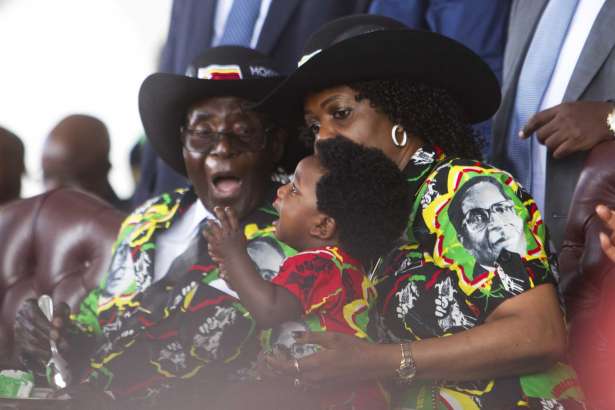 Zimbabwean President Robert Mugabe and his wife Grace, right, share a light moment with their grandson during his 93rd Birthday celebrations in Matopos on the outskirts of Bulawayo, Saturday, Feb. 25, 2017. Mugabe is celebrating his 93rd birthday amid granite hills were spirits are said to dwell, defying calls to resign after nearly four decades in power with a celebration in in a region for opposing a leader who says he will run again in 2018 elections