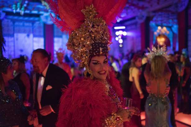 A guest in a costume poses for the photo as she enjoys a traditional Carnival ball at the Copacabana Palace hotel in Rio de Janeiro, Brazil, Saturday, Feb. 25, 2017. In stark contrast to the hundreds of hard-charging street parties across Rio that are open to anyone, the "Baile do Copa" bills itself as a fairytale event where the country's elite can see and be seen in a hotel known for both opulence and a lengthy tradition of welcoming world leaders and stars.