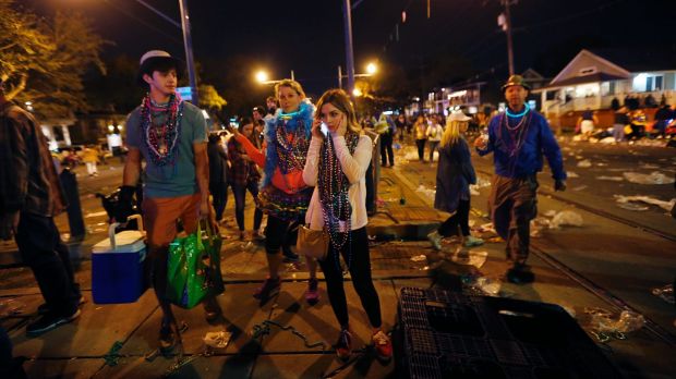 People leave the parade after the pick-up truck injured dozens.