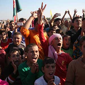 DEREK, SYRIA - NOVEMBER 13:  Yazidi refugees celebrate news of the liberation of their homeland of Sinjar from ISIL extremists, while at a refugee camp on November 13, 2015 in Derek, Rojava, Syria. Kurdish Peshmerga forces in Iraq say they have retaken Sinjar, with the help of airstrikes from U.S. led coalition warplanes. The Islamic State captured Sinjar in August 2014, killing many and sexually enslaving thousands of Yazidi women.  (John Moore/Getty Images)