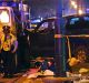 Police guard a pick-up truck that slammed into the crowd watching a Mardi Gras parade in New Orleans.