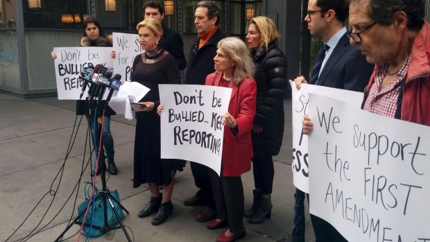 Democratic congresswoman Carolyn Maloney, foreground left, addresses the media in front of the <i>New York Times</i> ...