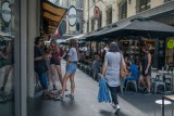 Young people hang around Degraves Street in Melbourne. 