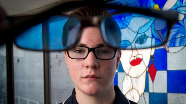 Silas Dewney, 14, says his coloured glasses have helped with his dyslexia.