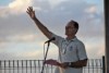 Reverend Stuart Hall raises his hand and voice skywards during prayers for rain in Townsville