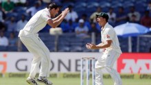 Mitchell Starc and Steve O'Keefe celebrate