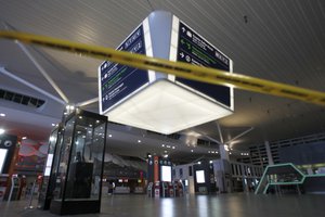 Tape blocks the entrance to the main hall of Kuala Lumpur International Airport 2 for the decontamination process in Sepang, Malaysia