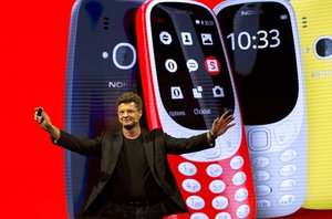 Arto Nummela, Chief Executive Officer at HMD Global, shows the new re-launched Nokia 3310 phone, ahead of Monday's opening of the Mobile World Congress wireless show in Barcelona, Spain