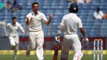 Steve O'Keefe celebrates a wicket in Pune