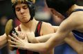 Euless Trinity's Mack Beggs, left, wrestles Grand Prairie's Kailyn Clay during the finals of the UIL Region 2-6A ...