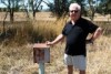 Robert Healy stands beside a short metal box near Queanbeyan.