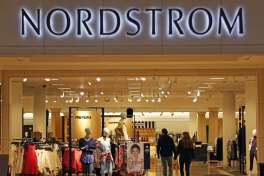In this  Feb. 8, 2017 file photo, shoppers walk into a Nordstrom store in Pittsburgh.  The department store operator said Thursday, Feb. 23,  that it earned $201 million, or $1.15 per share, for the period that ended Jan. 28. Earnings, adjusted for non-recurring costs, were $1.37 per share. That exceeds the $1.13 per share that analysts surveyed by Zacks Investment Research were anticipating.