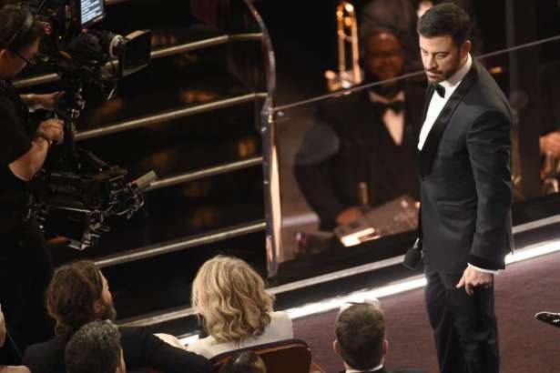 Host Jimmy Kimmel, right, stares at Matt Damon after Damon tripped him during a skit at the Oscars on Sunday, Feb. 26, 2017, at the Dolby Theatre in Los Angeles. (Photo by Chris Pizzello/Invision/AP)