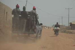 Security officers patrol the area near to the site where gunmen abducted German archaeologists professor Peter Breunig and his associate Johannes Behringer in Janjala Village, Nigeria. Friday, Feb. 24, 2017.  Kidnappers are demanding a ransom of 60 million naira (about Dlrs 200,000 US) for the two captives abducted this week from Janjala village in northern Nigeria, the excavation site where the German archaeologists was working. Two villagers were shot and killed in the kidnapping, police confirmed Friday.