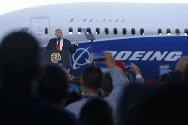 President Donald Trump speaks to Boeing employees, Friday, Feb. 17, 2017, in the final assembly building at Boeing South Carolina in North Charleston, S.C. The president visited the plant where Boeing rolled out the first 787-10 Dreamliner aircraft from its assembly line seen in back.