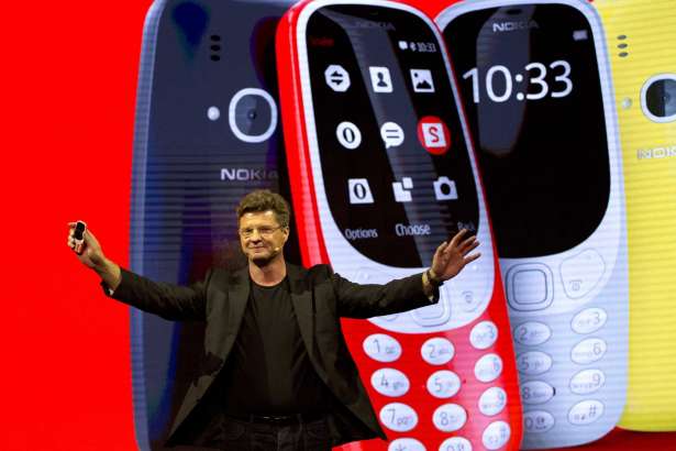 Arto Nummela, Chief Executive Officer at HMD Global, shows the new re-launched Nokia 3310 phone, ahead of Monday's opening of the Mobile World Congress wireless show in Barcelona, Spain, Sunday, Feb. 26, 2017. Finland-based HMD Global is re-launching the simple Nokia 3310 model along with unveiling three new devices at Mobile World Congress in Barcelona.