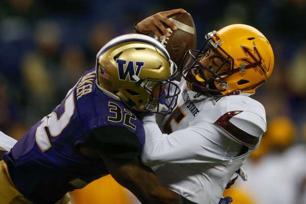 SEATTLE, WA - NOVEMBER 19:  Quarterback Manny Wilkins #5 of the Arizona State Sun Devils is sacked by defensive back Budda Baker #32 of the Washington Huskies on November 19, 2016 at Husky Stadium in Seattle, Washington. The Huskies defeated the Sun Devils 44-18.  (Photo by Otto Greule Jr/Getty Images)