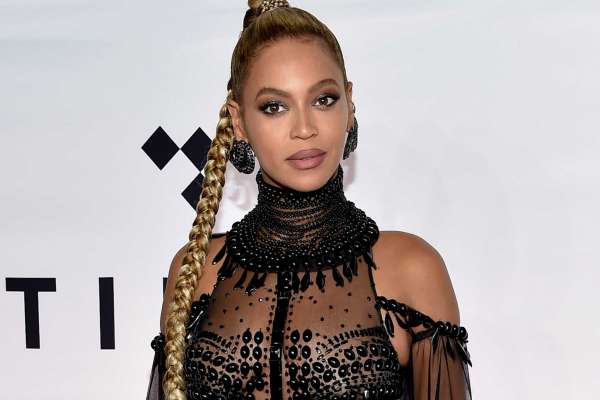 FILE - In this Oct. 15, 2016 file photo, singer Beyonce Knowles attends the Tidal X: 1015 benefit concert in New York.  Beyonce is nominated for Grammy Awards for best album, best song and record of the year. (Photo by Evan Agostini/Invision/AP, File)