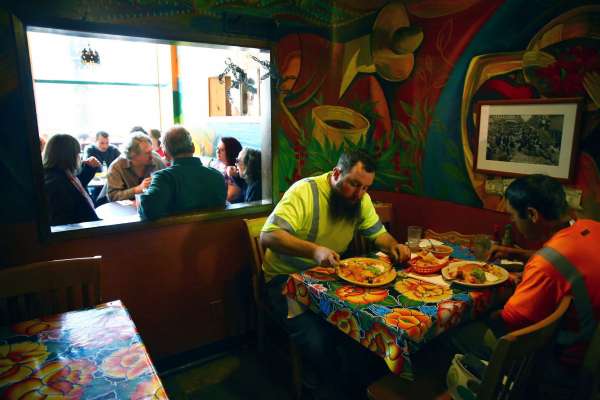 Diners eat lunch at Mama's Mexican Kitchen on the restaurant's last day in business, Mar. 31, 2016.  Mama's has been a Belltown fixture for over forty years.
