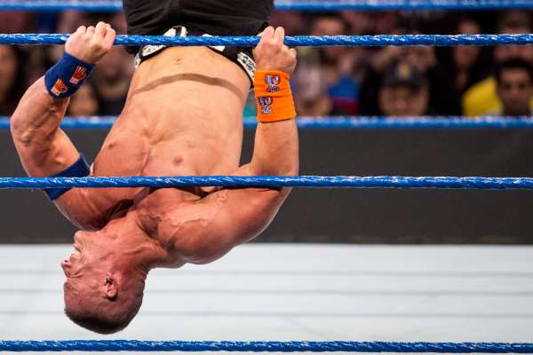 John Cena clutches on to the ropes while battling Ryan Orton during WWE Smackdown Live at KeyArena on Tuesday, Feb. 7, 2017.