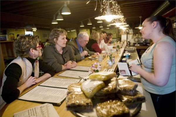 Chelsey Ulvin takes a lunch order from Karen Hake-Santana and Kare Shults at The Maltby Cafe.