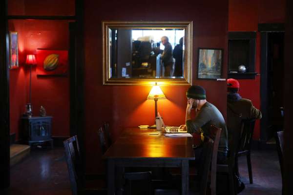 People work and read inside Chocolati Cafe in Greenwood Tuesday, Jan. 10, 2017. (Genna Martin, seattlepi.com)