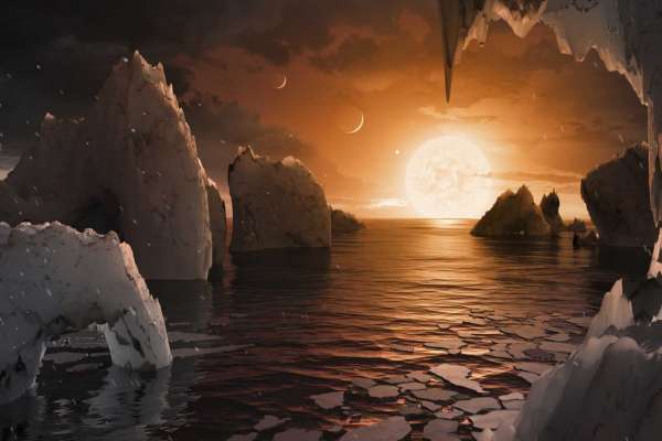 This image provided by NASA/JPL-Caltech shows an artist's conception of what the surface of the exoplanet TRAPPIST-1f may look like, based on available data about its diameter, mass and distances from the host star. The planets circle tightly around a dim dwarf star called Trappist-1, barely the size of Jupiter. Three are in the so-called habitable zone, where liquid water and, possibly life, might exist. The others are right on the doorstep. (NASA/JPL-Caltech via AP)