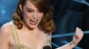 Emma Stone collects the Oscar for best actress for her performance in <i>La La Land</i>.