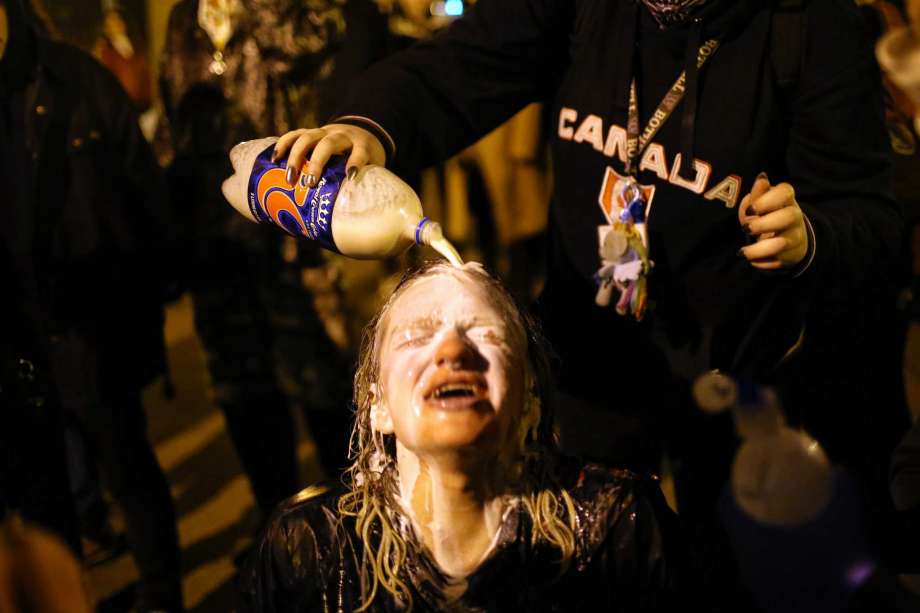 A young woman's eyes are washed out with milk after she is sprayed with pepper spray by police. Protesters and police clashed at the school as Milo Yiannopoulos spoke inside. One man in the crowd was shot as supporters and opponents of the Breitbart.com editor waited to see if they would be able to attend his talk there. Photo: GENNA MARTIN,  SEATTLEPI.COM / SEATTLEPI.COM