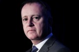 QBE chief executive John Neal disclosed a relationship with his assistant and suffered a $550000 cut to his bonus, ...